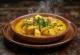 Ananas, balık ve Hindistan cevizi sütü ile servis edilen Moqueca